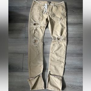 Distressed zipper jeans
